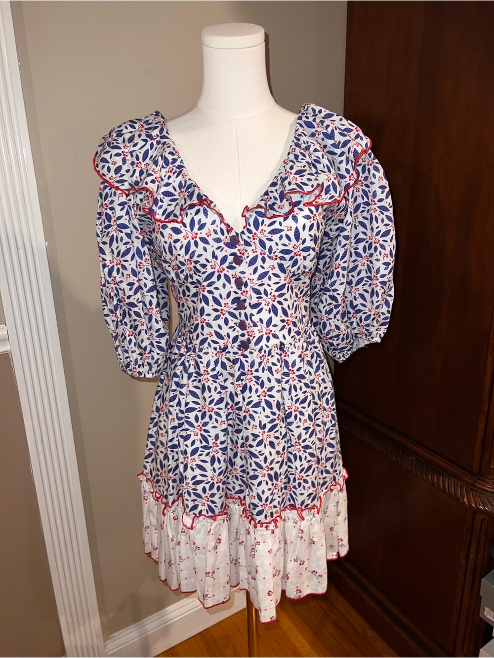 V-Neck Mini Dress with Blue Floral Print and Red Trim